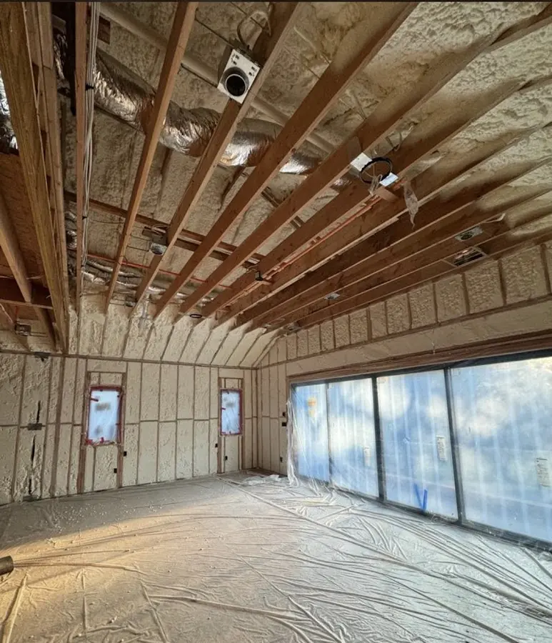 Interior walls and ceiling insulated with spray foam during new construction in Fort Shawnee